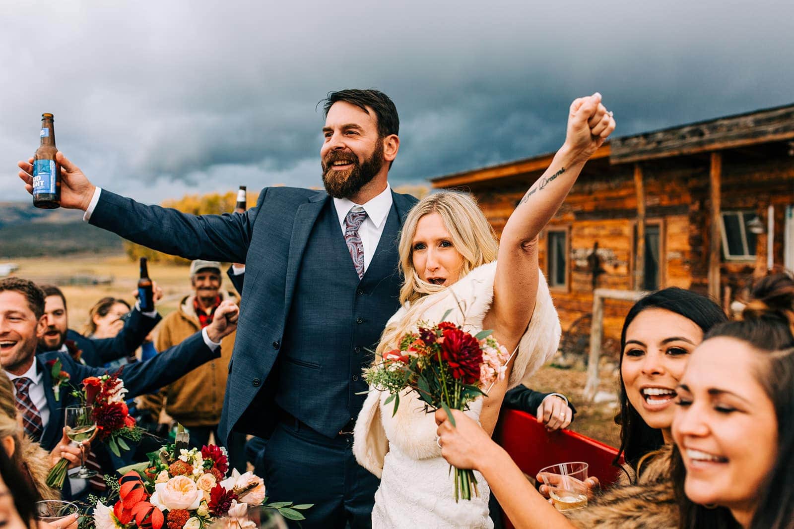 Couple cheering on their wedding day in Colorado
