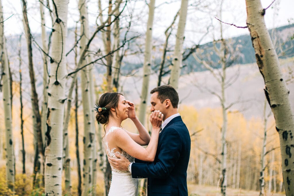 First look with bride and groom outside in the Aspen trees