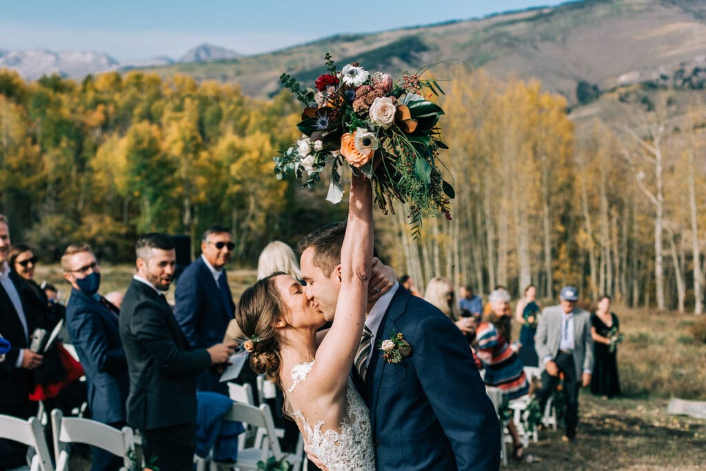 outdoor photos from fall ceremony in Crested Butte with fall colored Aspen leaves