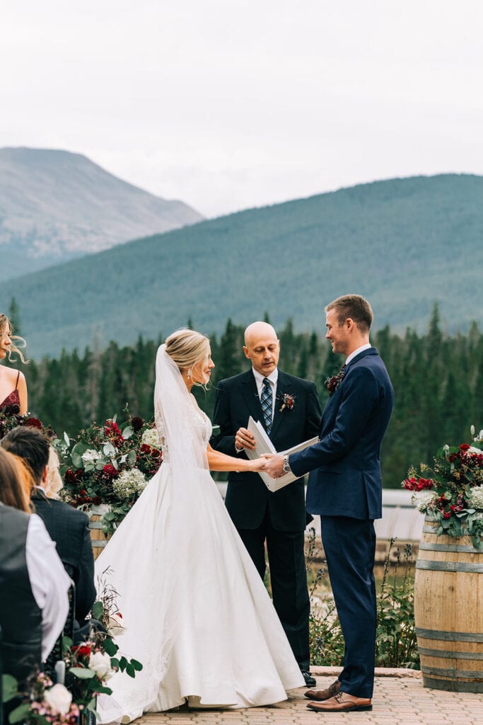 Couple sharing vows at ceremony at 10 mile station