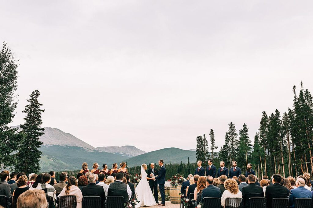 Outdoor summer wedding ceremony with mountain views at 10 Mile Station