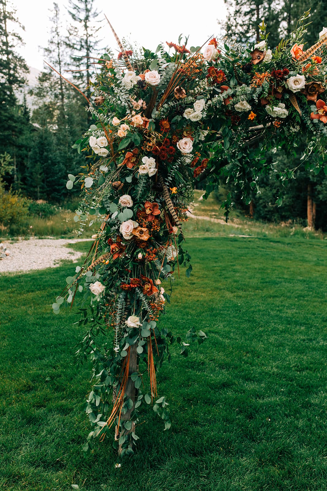 Photo of the flower arch  at a wedding at The nordic center in Breckenridge