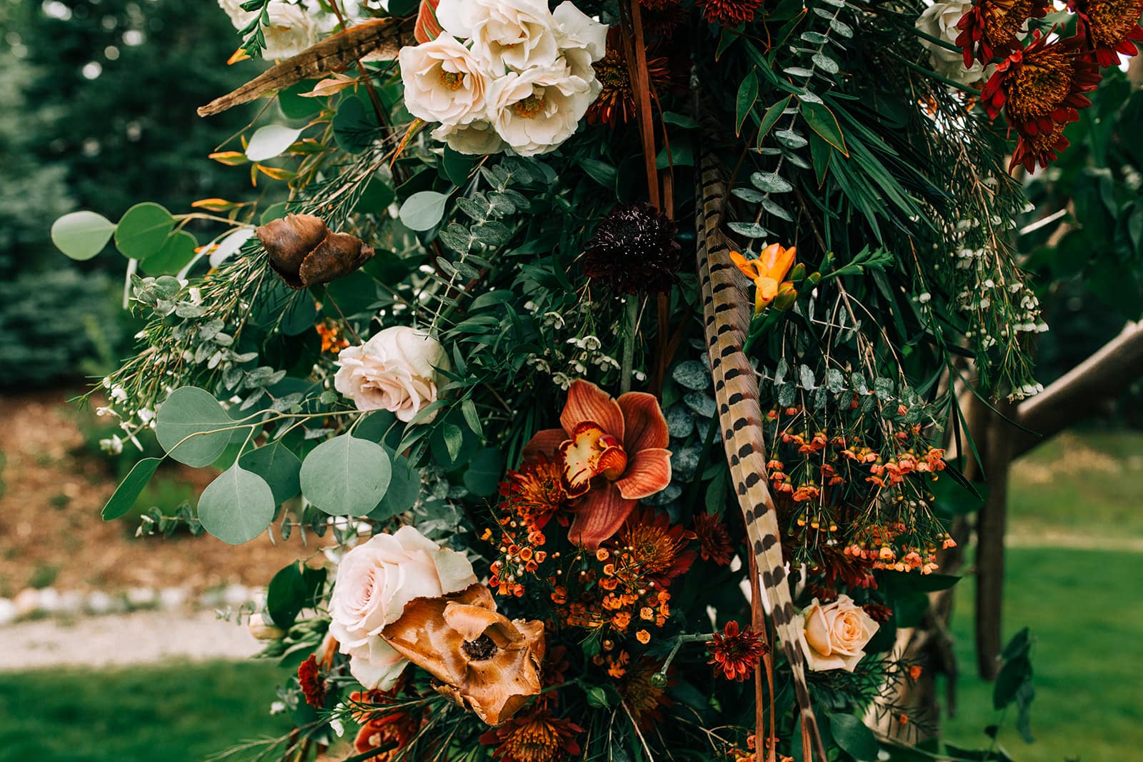 Photo of the flower arch at a wedding at The nordic center in Breckenridge