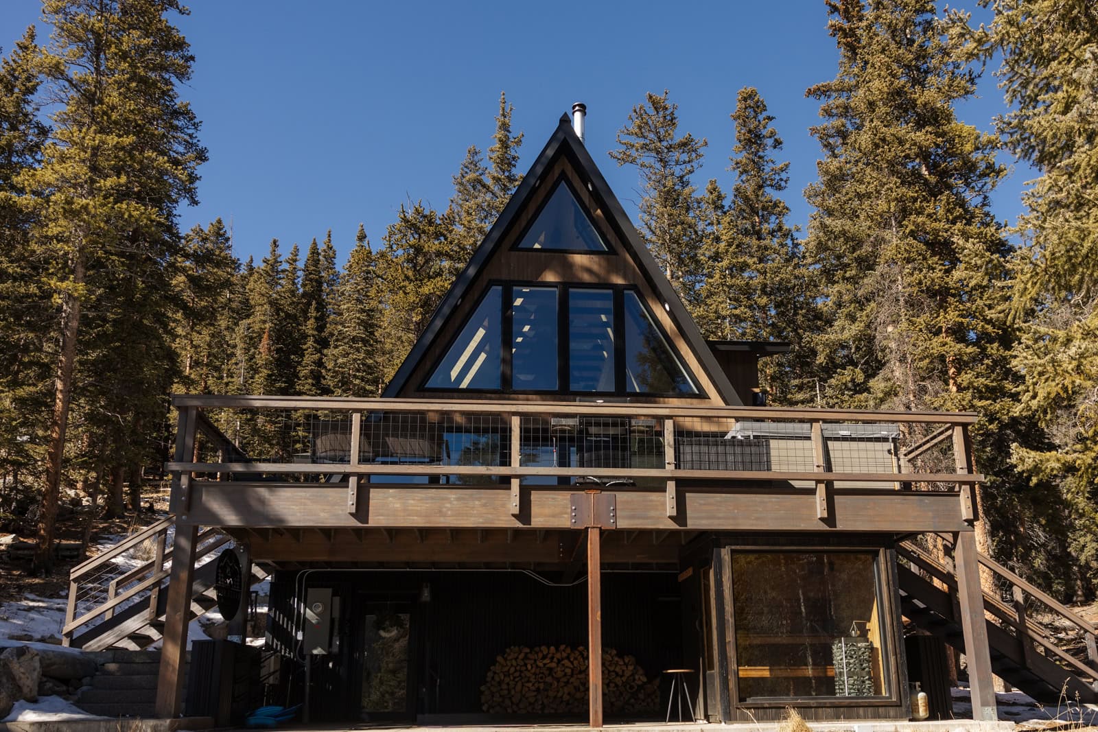 A frame cabin in Alma, Colorado with big deck and sauna under deck